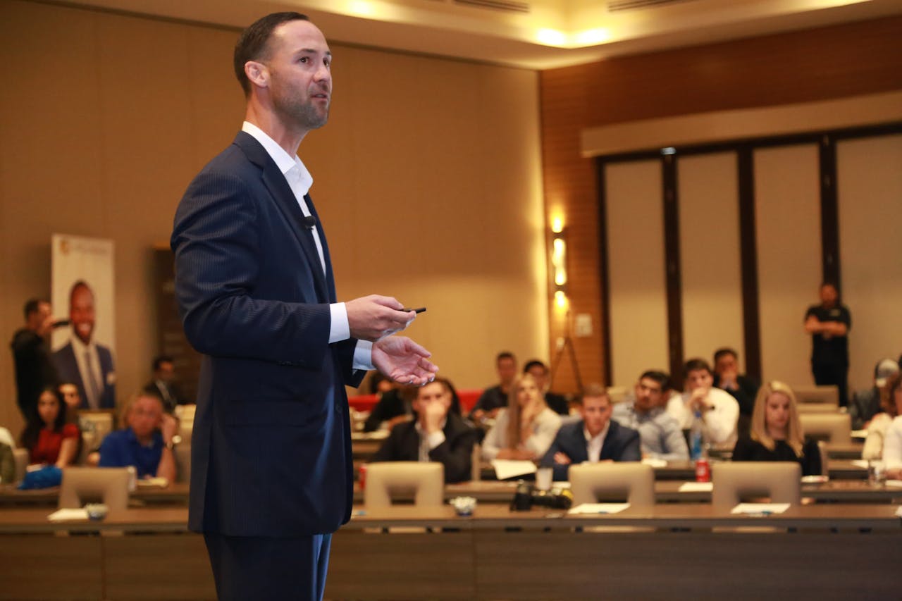 Mastering the First Impression: Your intriguing post title goes here A dynamic speaker engages professionals during a business conference presentation.